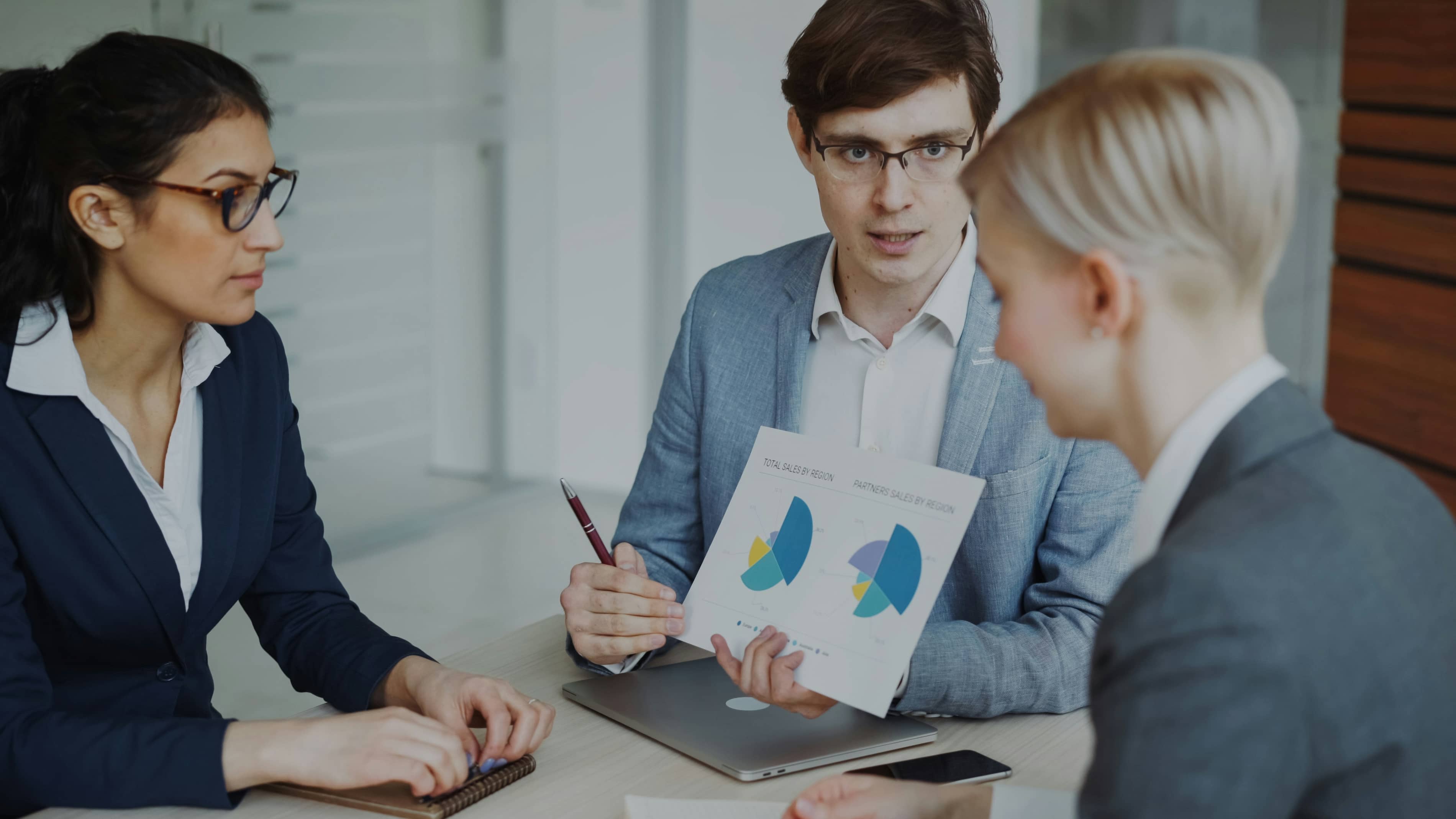 A couple discussing financing options with a bank advisor