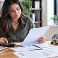 Homeowner calculating the break-even point of refinancing a mortgage in NZ
