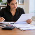Self-employed borrower organising tax returns and bank statements for a mortgage application in NZ